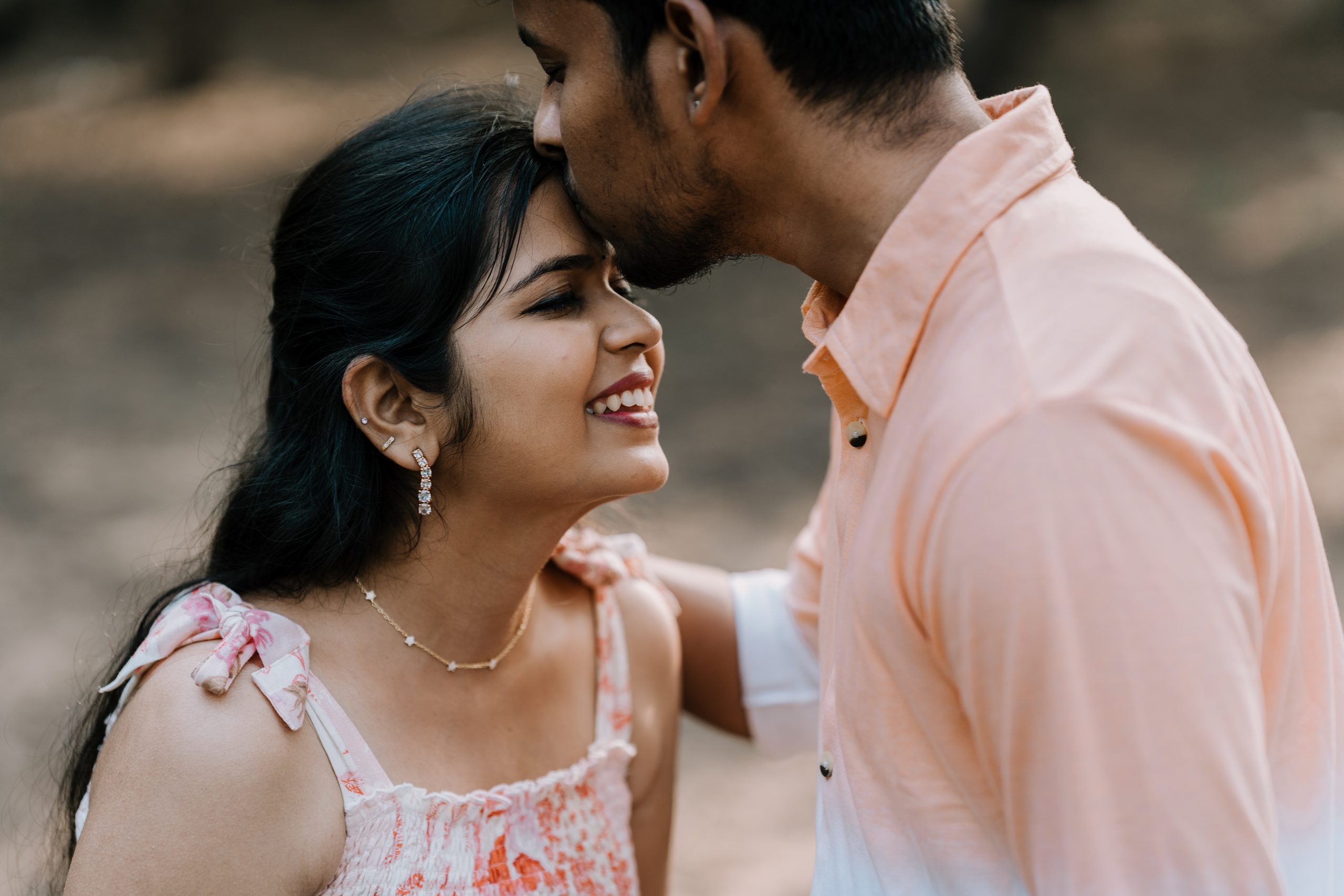 A quiet moment between the couple, photographed outdoors